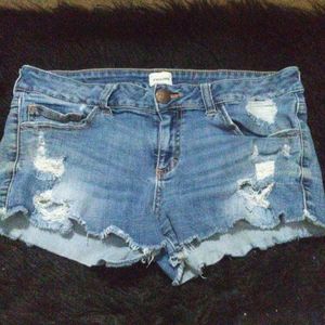 Ripped jean shorts worn like twice